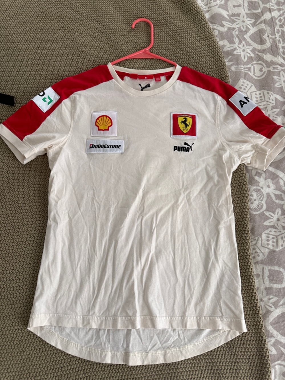 Puma Tacing. Off White Short Sleeve Team Shirt with Red Shoulder Panels